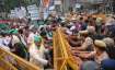 Police try to stop the farmers protesting over their