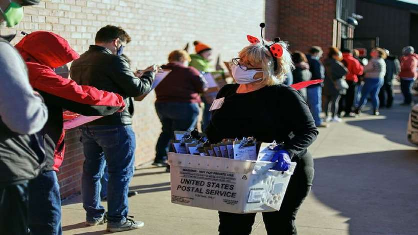 With coronavirus cases spiking in most of the country, millions of Americans are mailing in ballots or lining up at socially distanced intervals at early voting stations to have their say well beforehand.