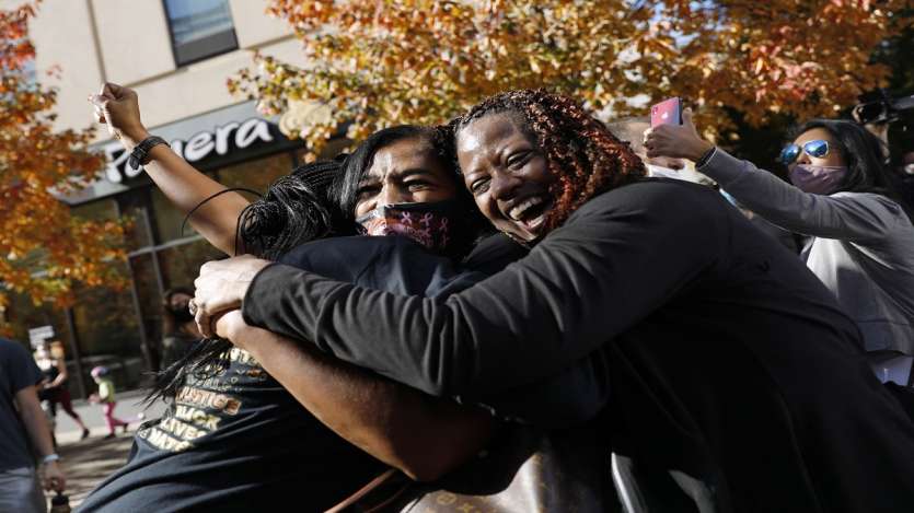 People celebrate in Philadelphia after Democrat Joe Biden defeated President Donald Trump to become the 46th president of the United States.